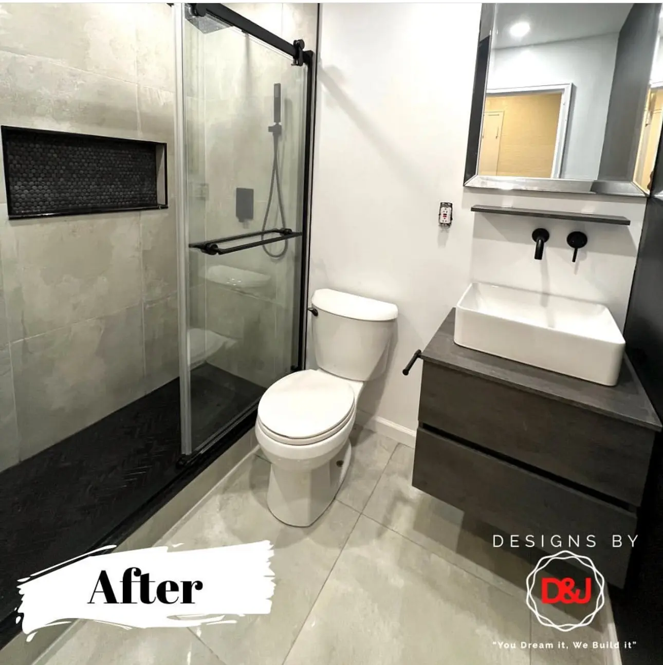 Modern bathroom renovation completed with new tiles, vanity, and lighting by Designs by D and J in NYC and NJ.