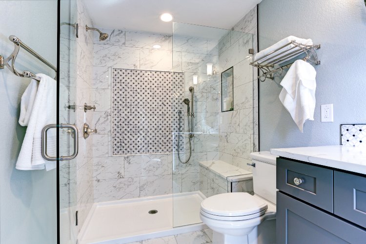 Luxury bathroom remodel with glass shower and marble tiles by expert contractors in New Jersey.